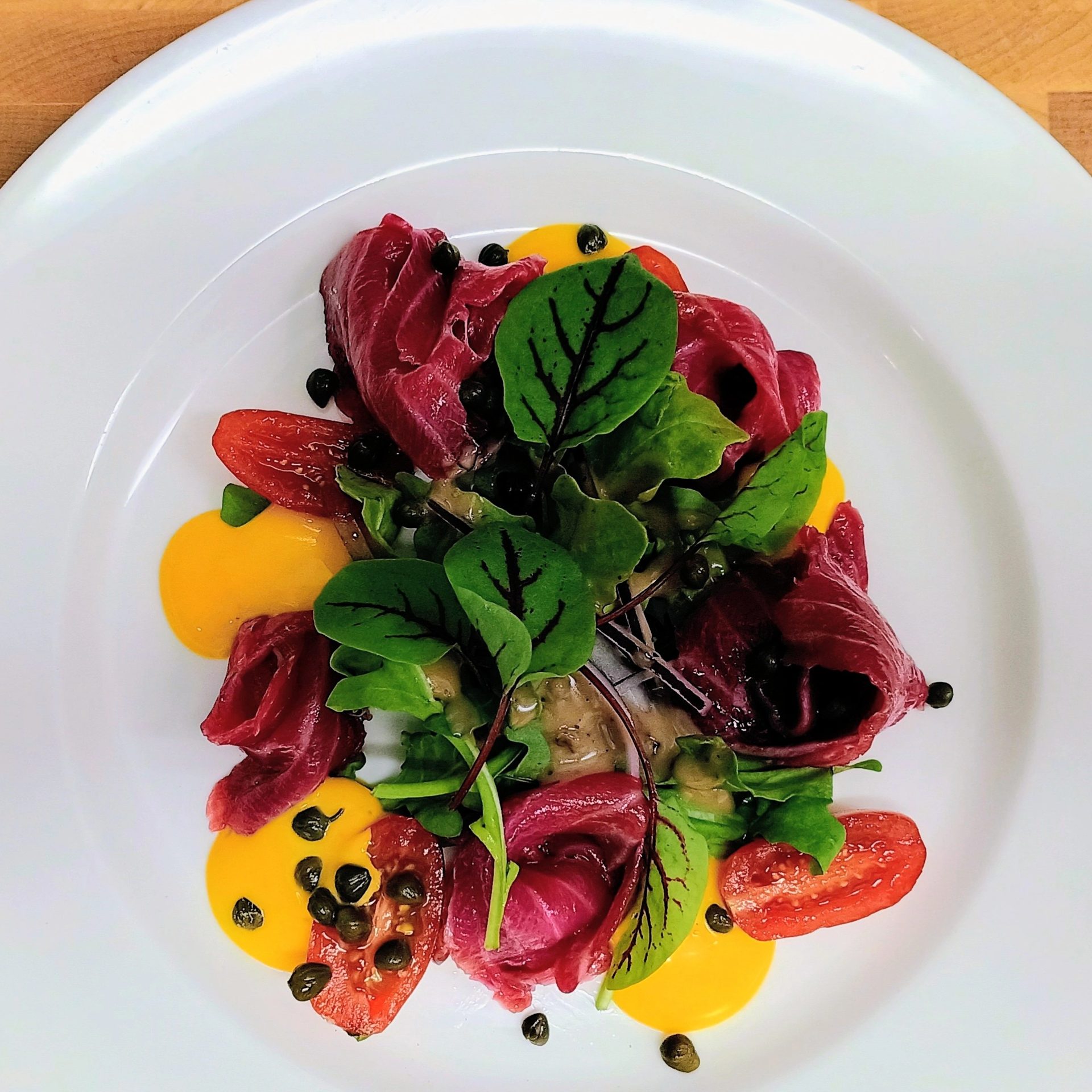 Beet-cured salmon with saffron aioli and red vein sorrel
