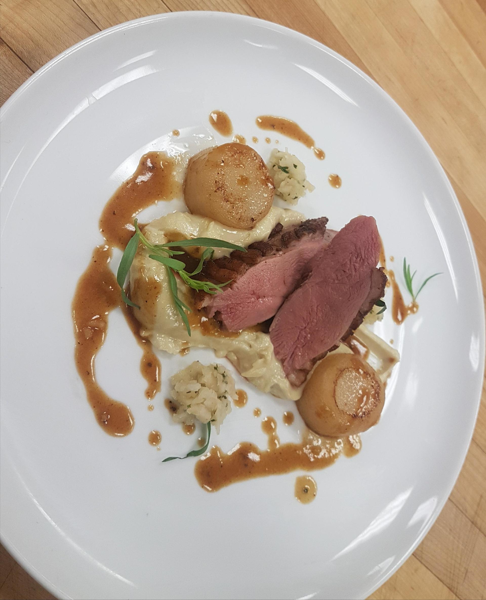 Duck breast with seared scallops