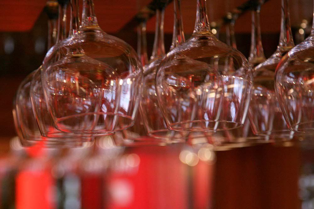 Wine glasses hanging above the bar